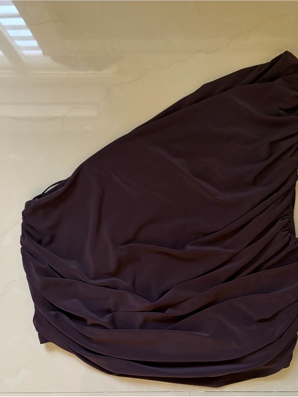 Express brown one-shoulder top.